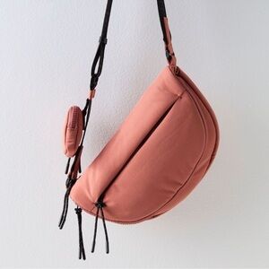 FP Movement by Free People in Rose Dust Hit The Trails crossbody sling bag.